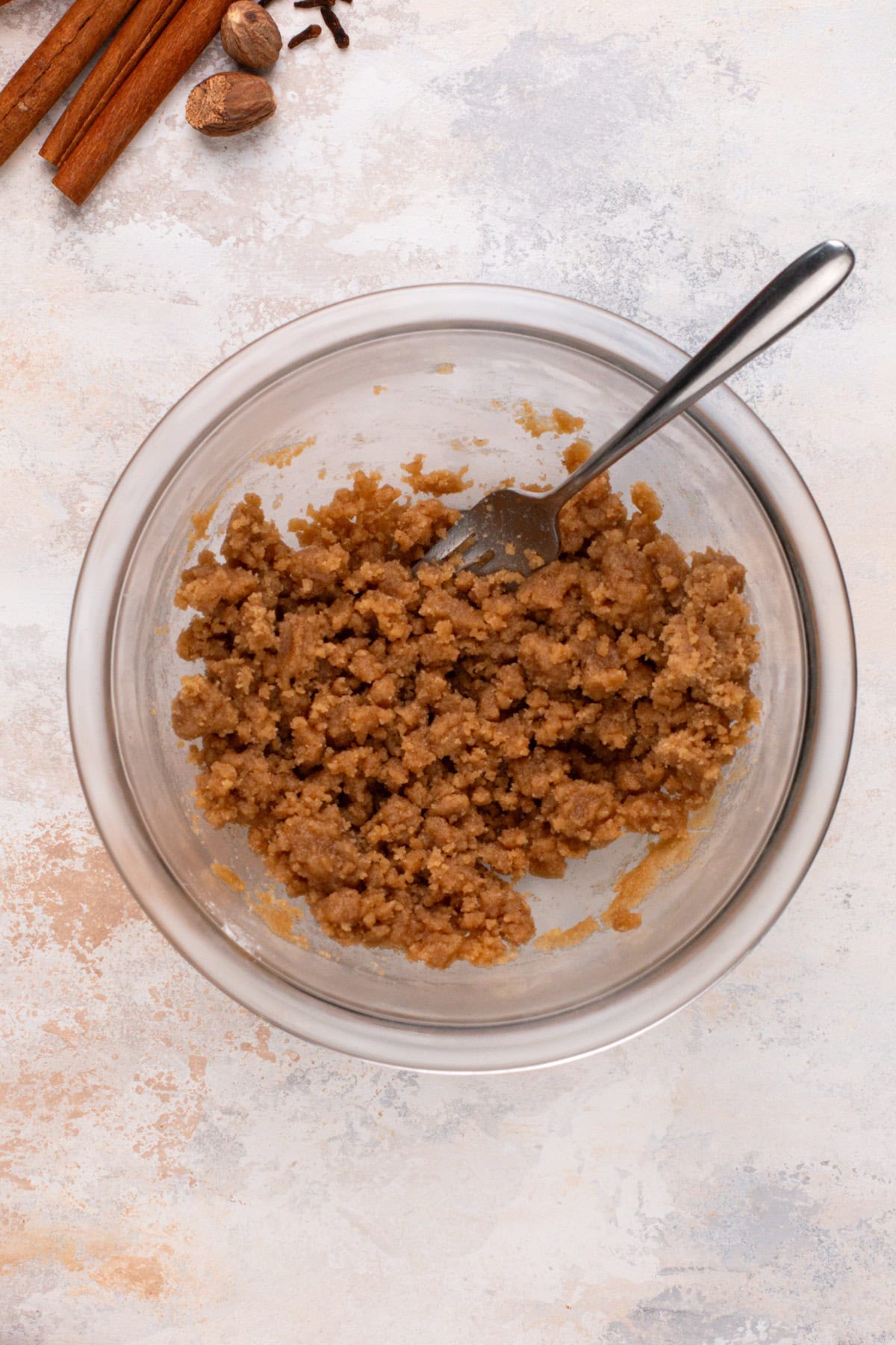 Streusel topping mixed in a glass bowl.