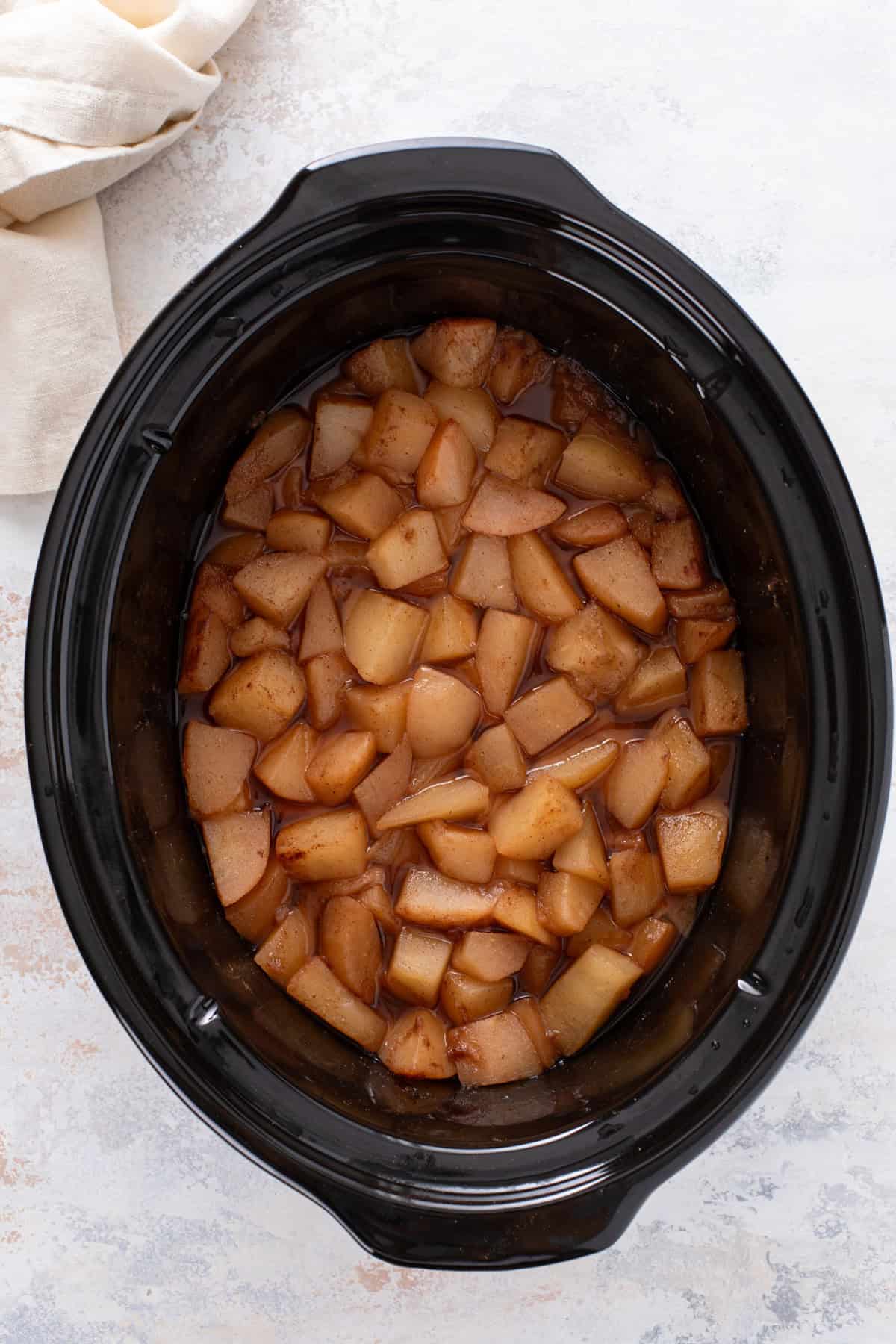 Pears cooked down in a slow cooker.
