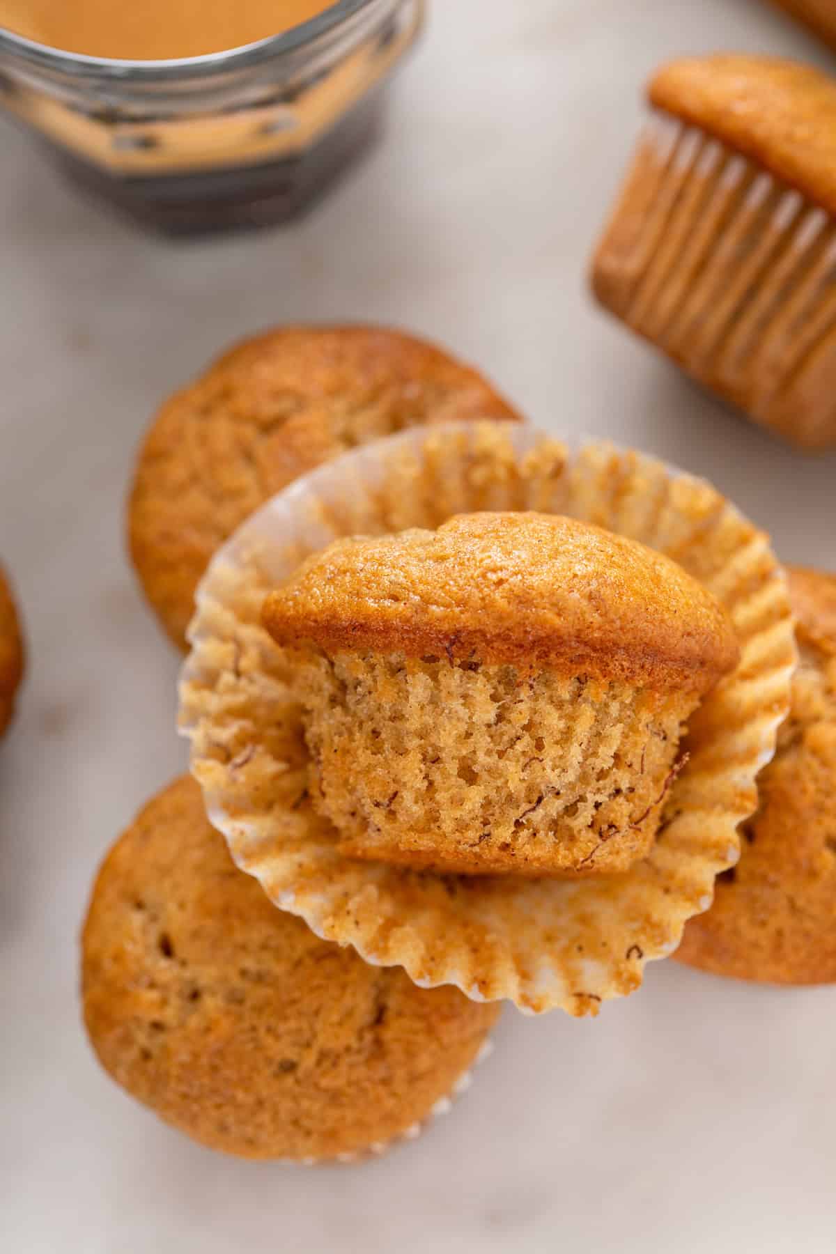 Close up of an unwrapped mini banana muffin.