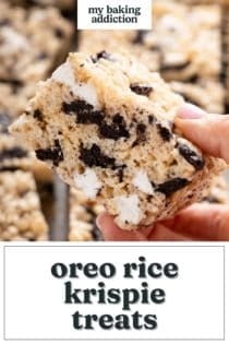 Person holding up a sliced oreo rice krispie treat to the camera. Text overlay includes recipe name.