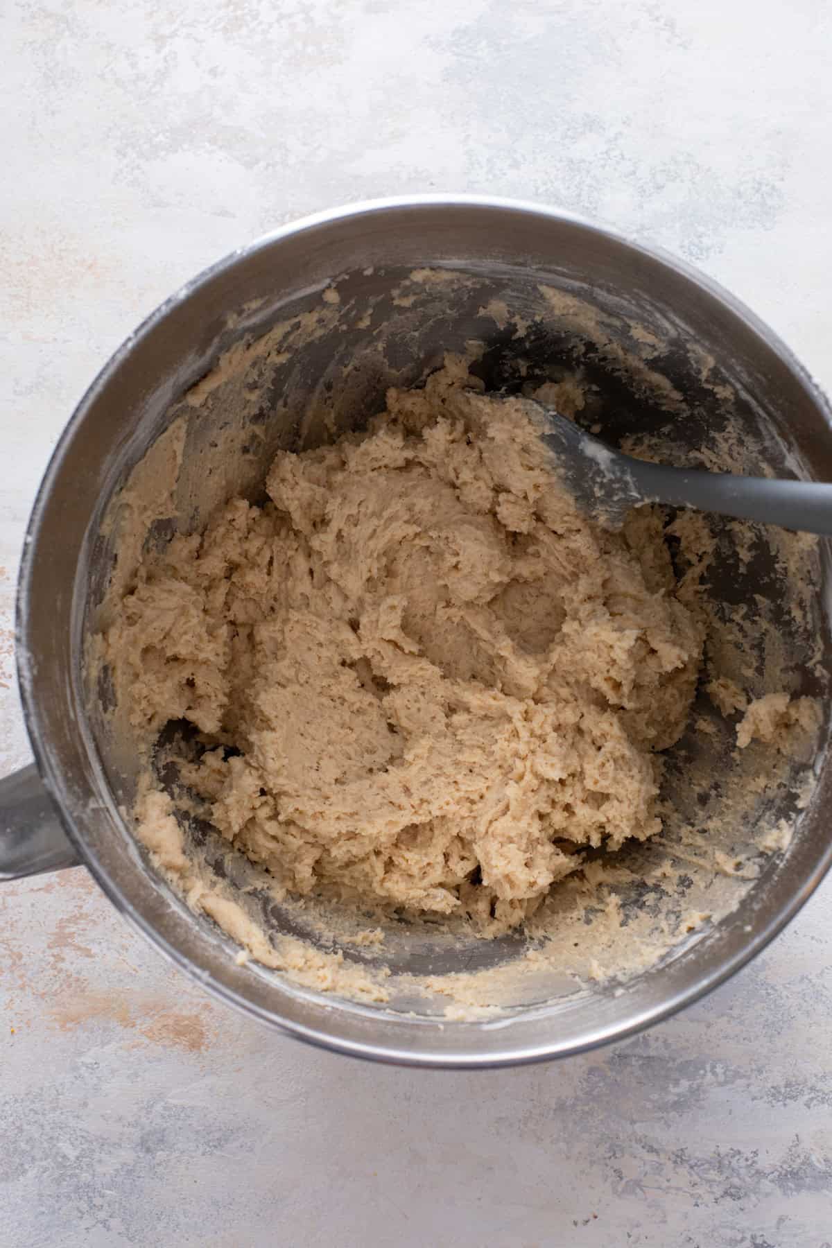 Cake batter for cream cheese coffee cake mixed in a metal bowl.