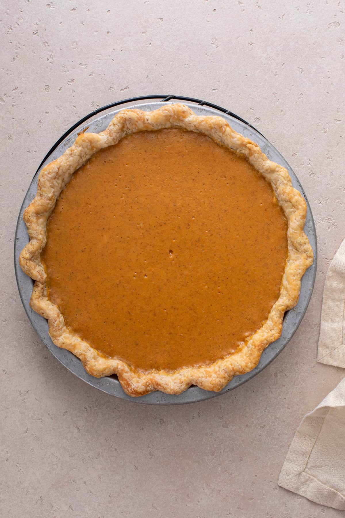 Baked and cooled pumpkin cheesecake pie.