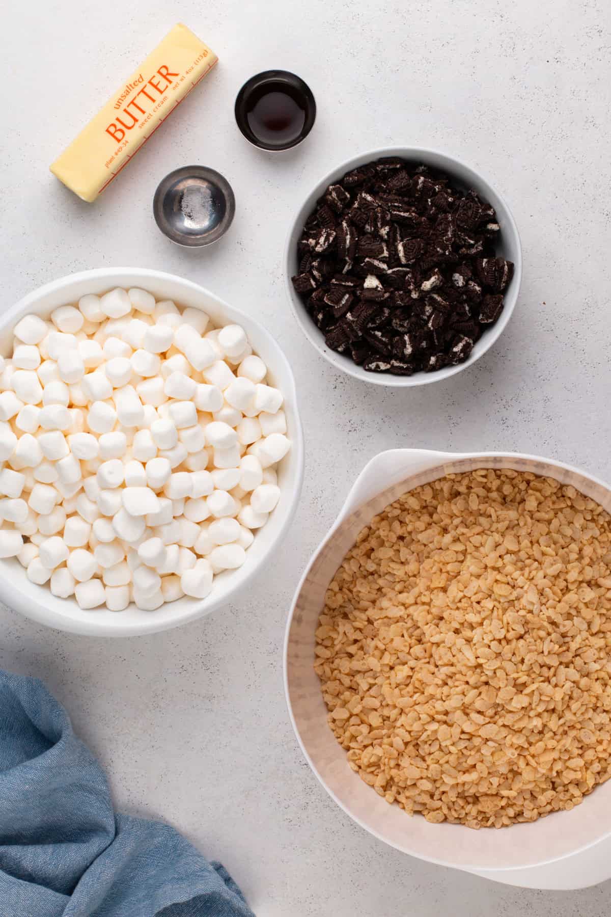 Ingredients for oreo rice krispie treats arranged on a countertop.