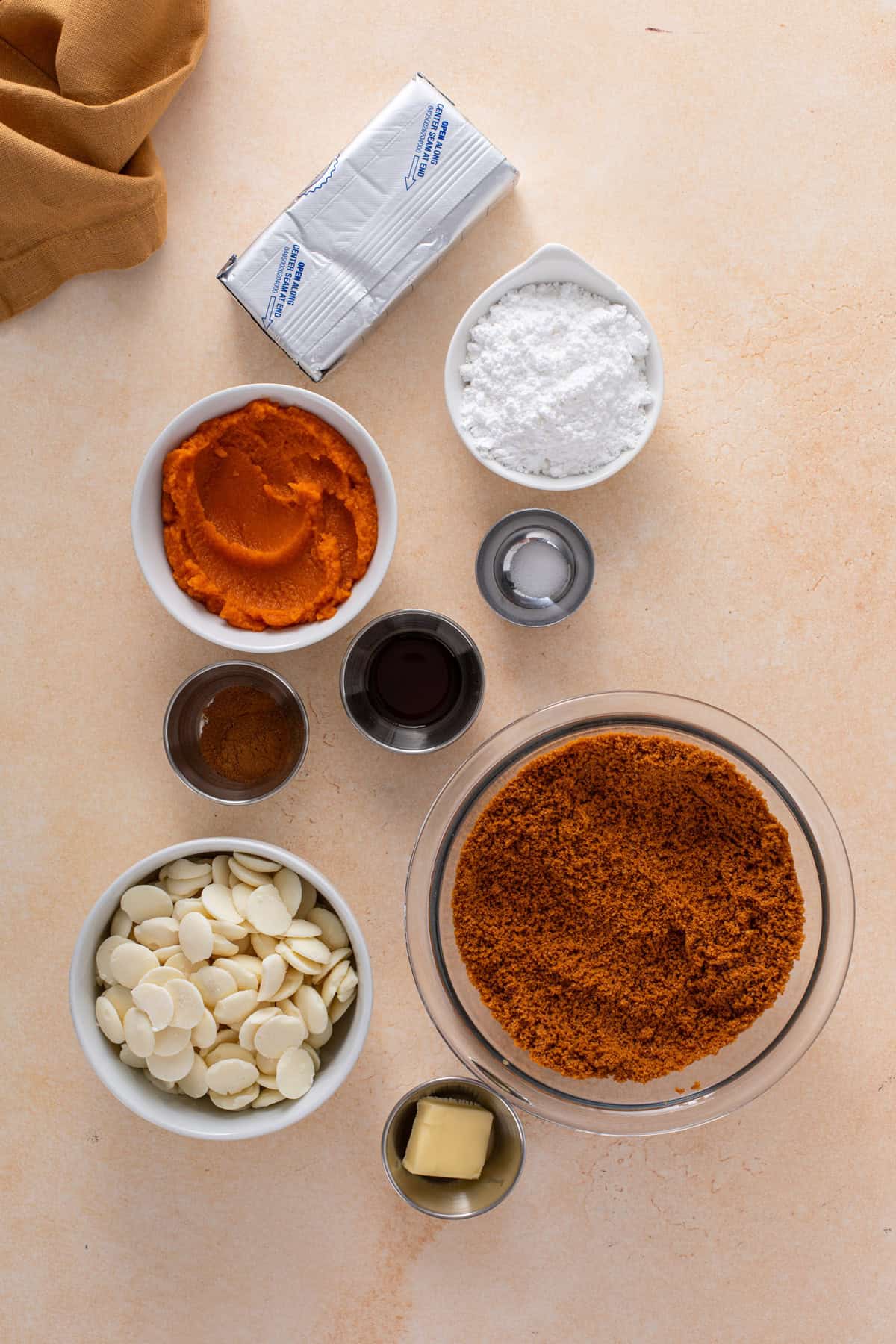 No-Bake pumpkin cheesecake ball ingredients arranged on a countertop.