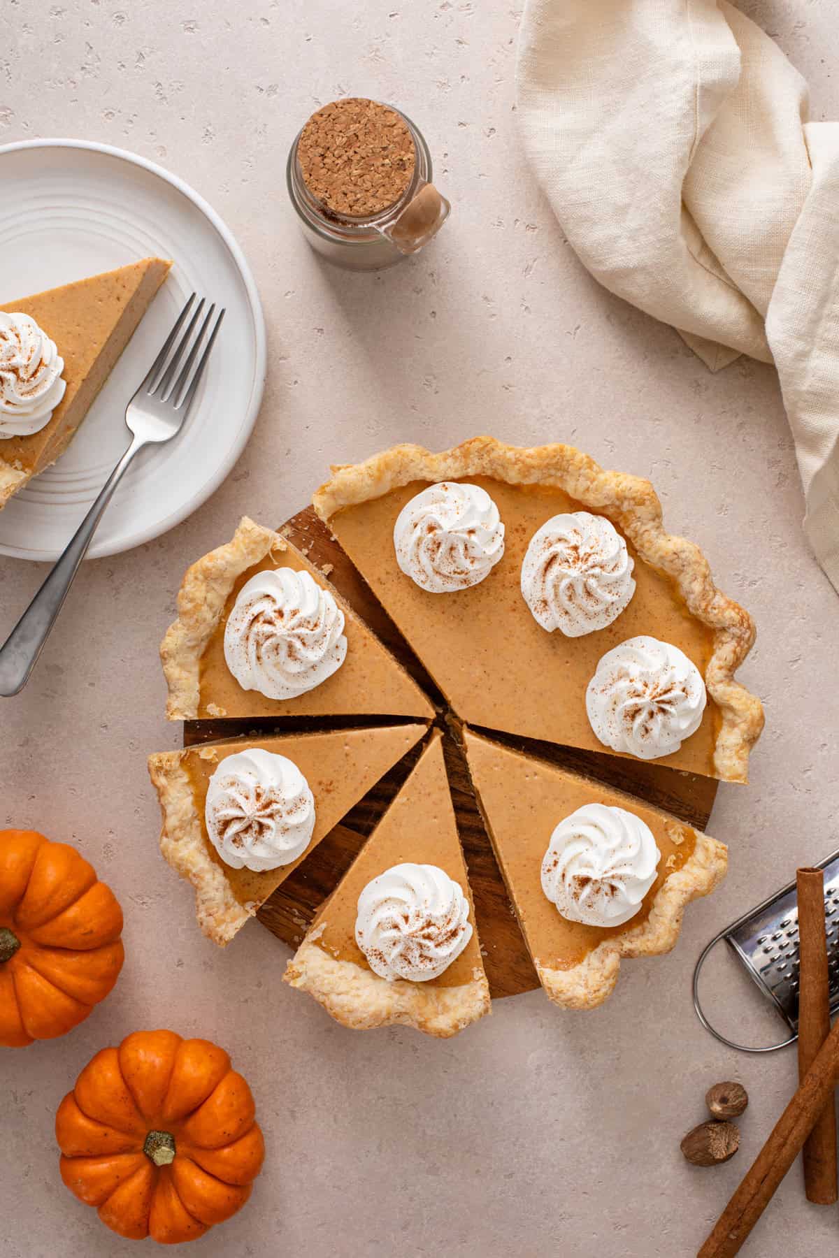 Overhead view of sliced pumpkin cheesecake pie.