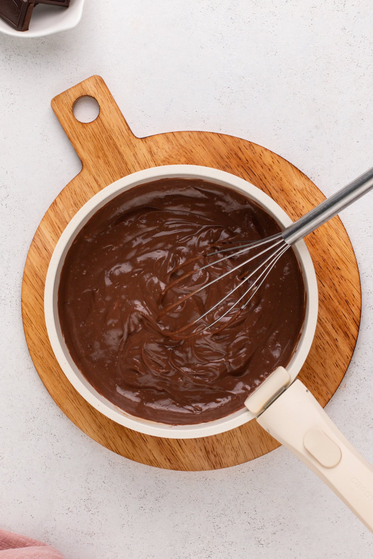 Whisked chocolate pudding in a saucepan.
