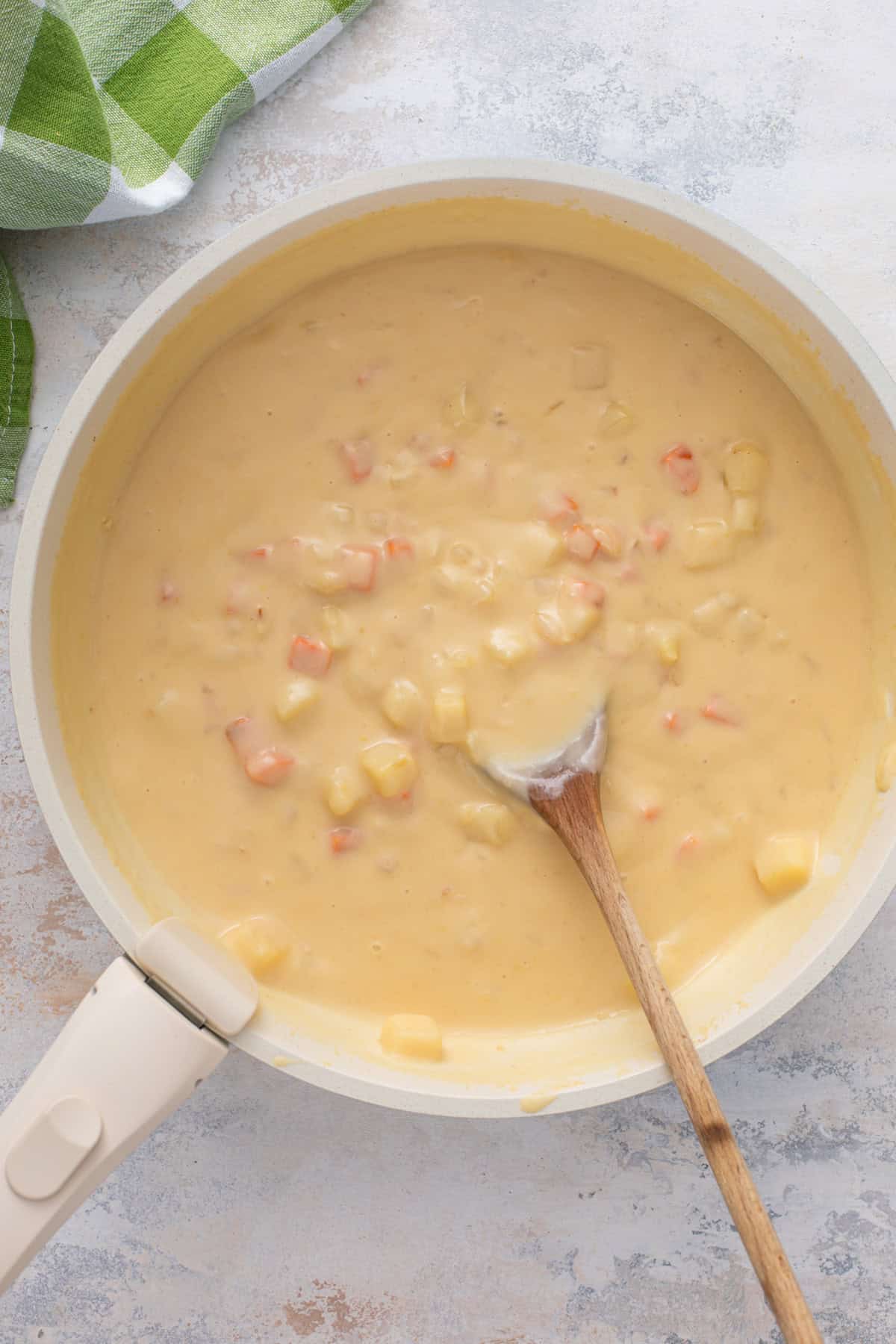 Chicken pot pie filling base simmering in a skillet.