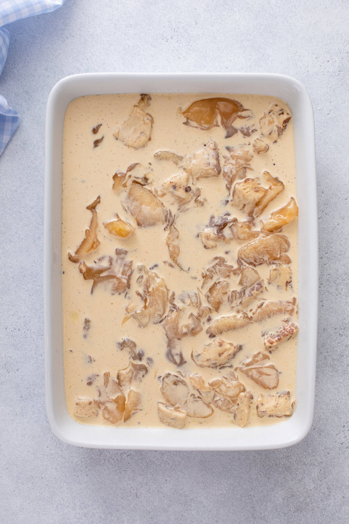 Assembled cinnamon roll casserole ready to go in the oven.