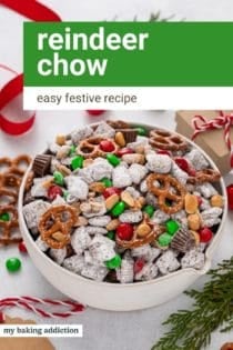 White bowl filled with reindeer chow surrounded by Christmas decorations. Text overlay includes recipe name.