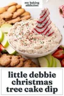 Christmas tree dip in a bowl, decorated with sprinkles and a christmas tree cake. Text overlay includes recipe name.