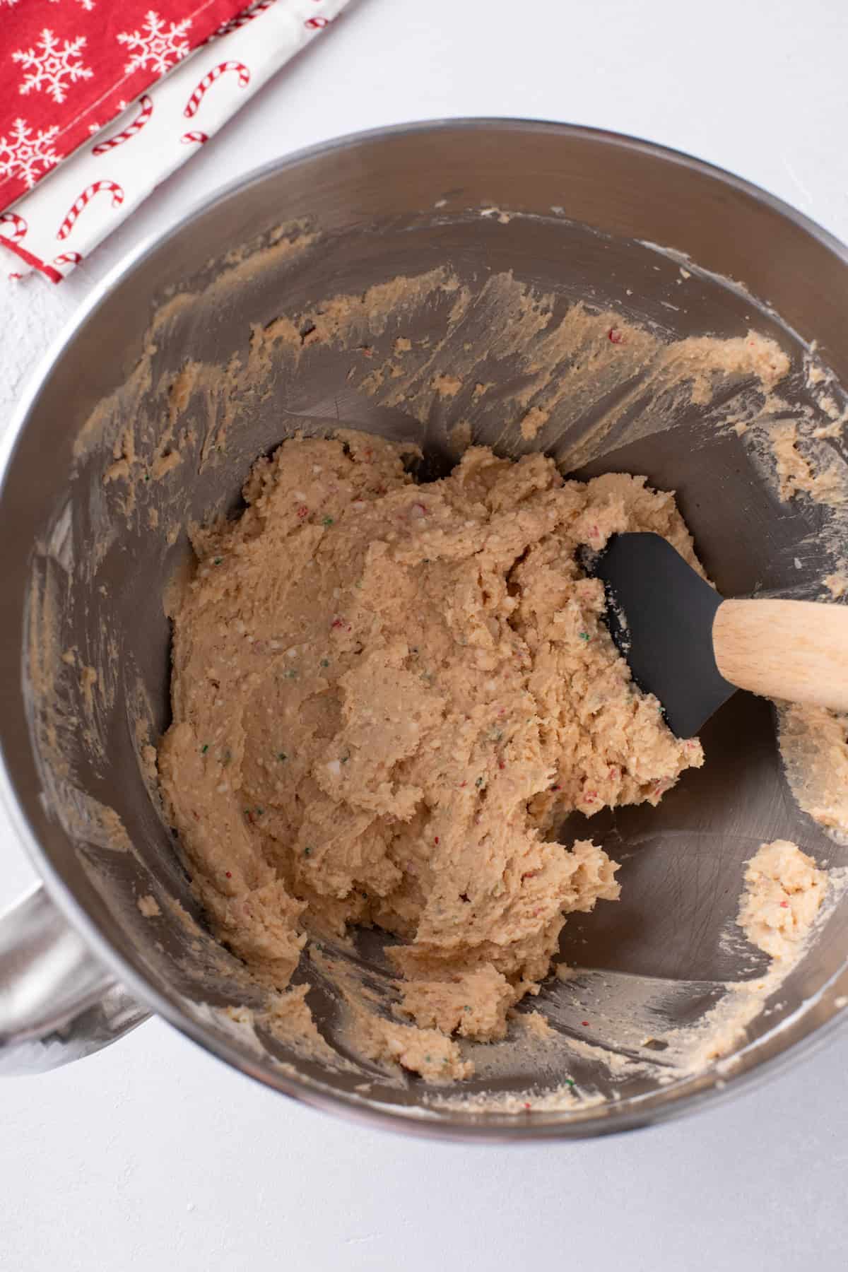 Cream cheese and little debbie christmas tree cakes mixed in a bowl.