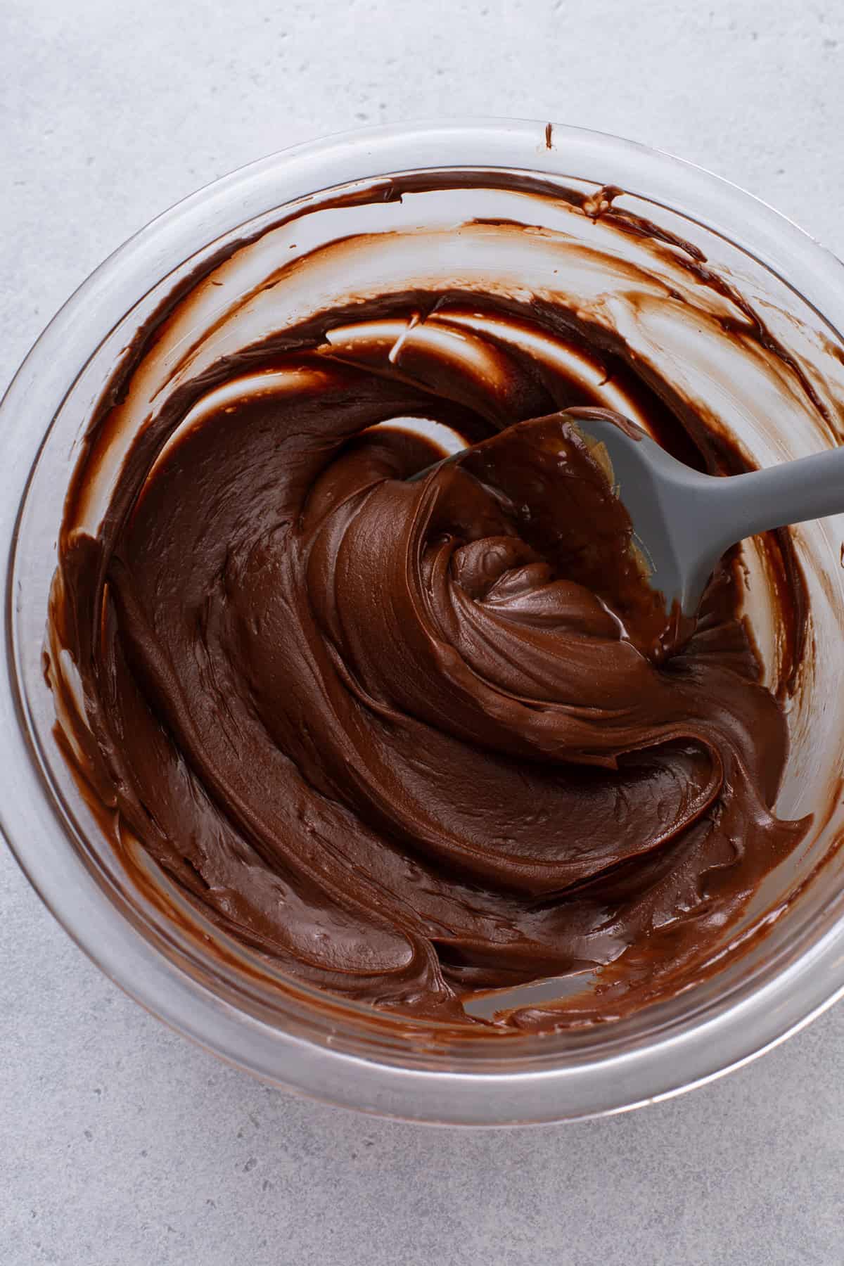 Melted chocolate, peanut butter, and butter for reindeer chow.