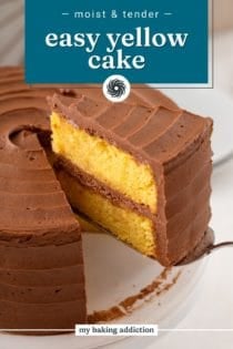 Cake server lifting a slice of easy yellow layer cake topped and filled with chocolate frosting. Text overlay includes recipe name.