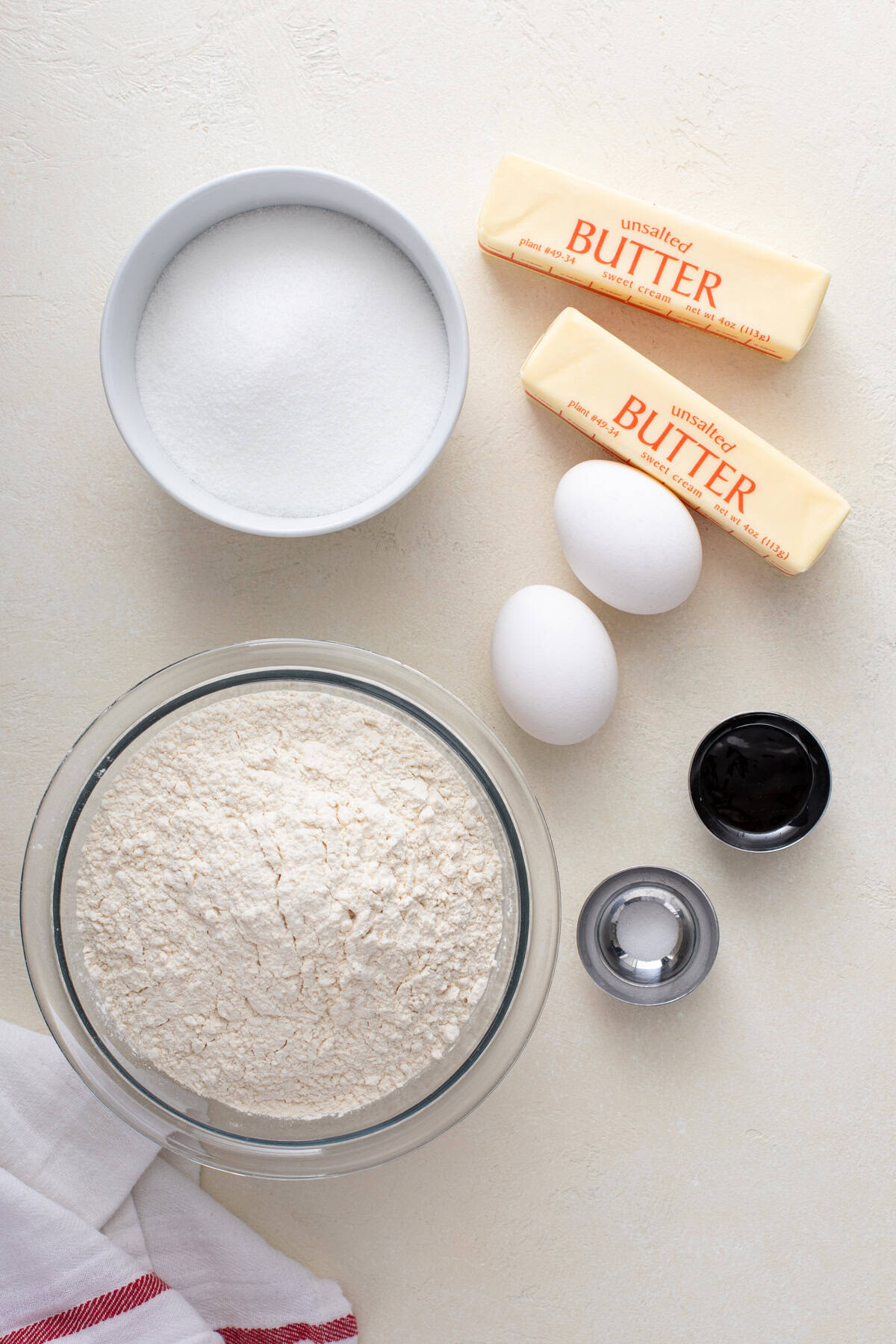 Ingredients for no-spread sugar cookies arranged on a countertop.