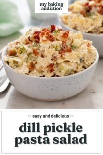 Close up of a small bowl filled with dill pickle pasta salad. A second bowl is visible in the background. Text overlay includes recipe name.